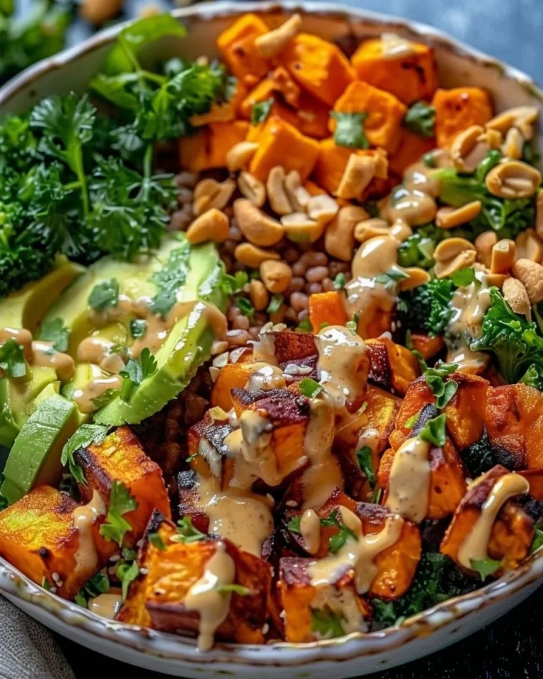 Thai Peanut Sweet Potato Buddha Bowl with colorful vegetables and peanut sauce